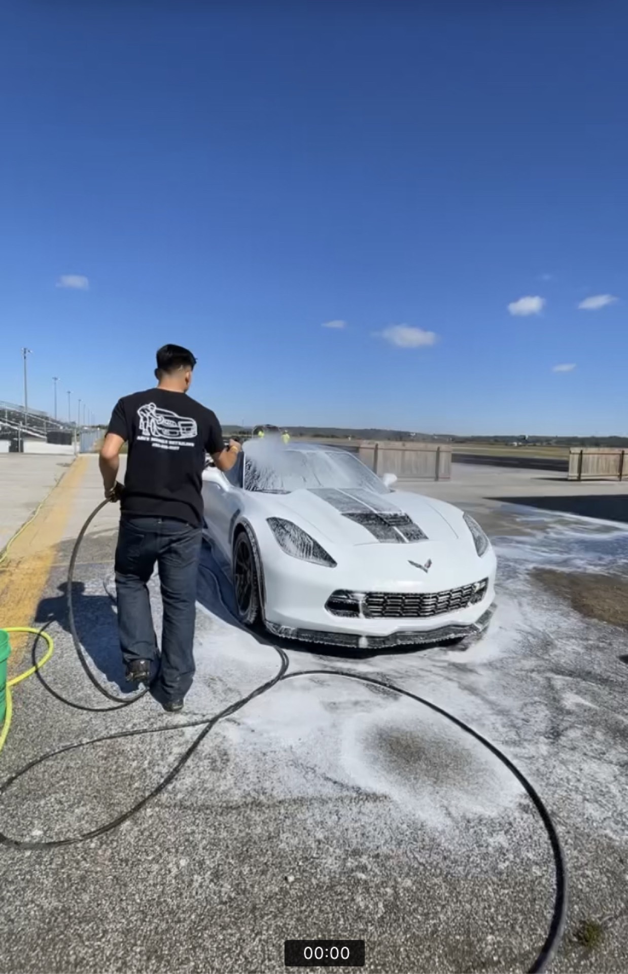 Ari's Mobile Detailing washing a Corvette at a customer's home in Omaha